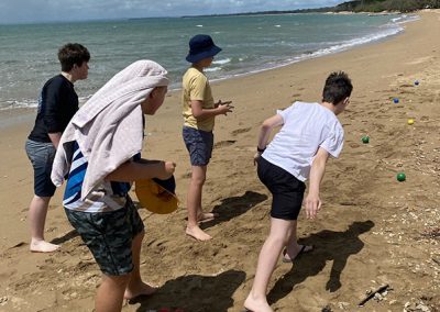Students playing on the beach