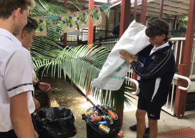 Students collecting cans to recycle