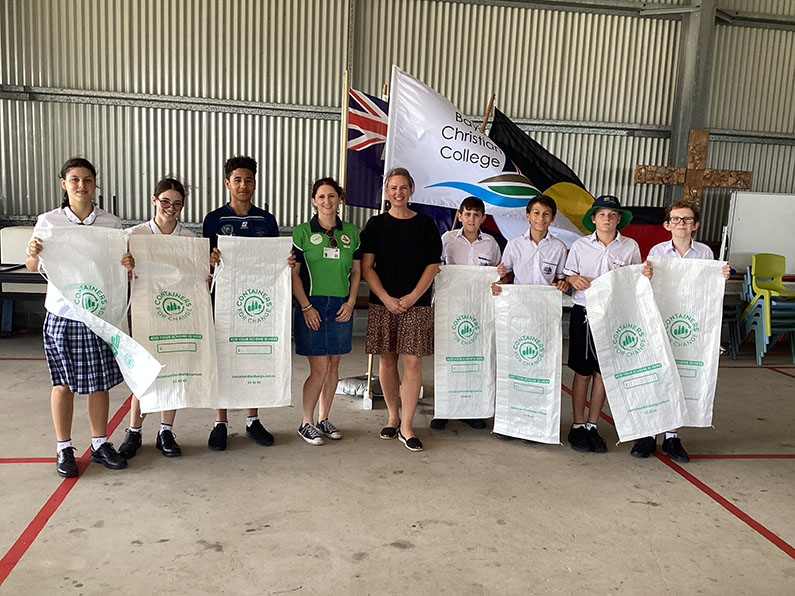 Students holding recycling bags
