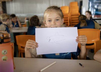 Student with shark drawing